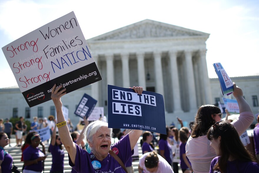 WASHINGTON, DC - JUNE 26:  Supporters of women's rights protest outside the U.S. Supreme Court as the court issues a ruling on a California law related to abortion issues on June 26, 2018 in Washington, DC. A Calfornia law requiring "pregnancy crisis centers" to inform women of abortion options was ruled as a likely violation of first amendment rights by the court.  (Photo by Win McNamee/Getty Images)
