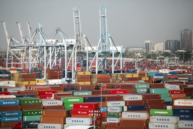 Cargo ships are loaded at the Ports of Los Angeles and Long Beach on Friday, Feb. 19, 2016.