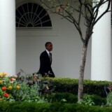 President Barack Obama walks along the colonnade before boarding Marine One.