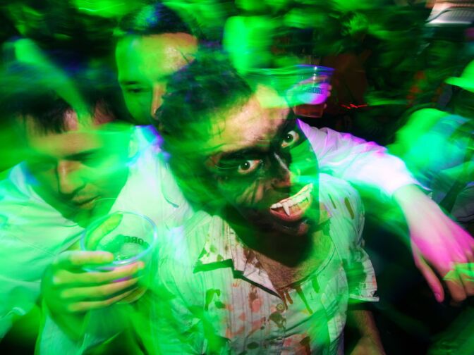 People dressed up as zombies during a Halloween Eve Party in Belgrade on October 30, 2011.  Halloween is based on the Celtic festival of Samhain and the ancient Celts believed the border between this world and the otherworld became thin on that night, allowing spirits to pass through. 