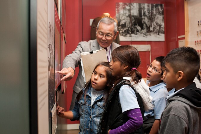 Mas Yamashita giving a guided tour to school children at the Japanese American National Museum. 