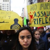 LOS ANGELES, CA - MARCH 24: Young activists stand before marching during the March for Our Lives rally on March 24, 2018 in Los Angeles, California. More than 800 March for Our Lives events, organized by survivors of the Parkland, Florida school shooting on February 14 that left 17 dead, are taking place around the world to call for legislative action to address school safety and gun violence.  (Photo by Mario Tama/Getty Images)