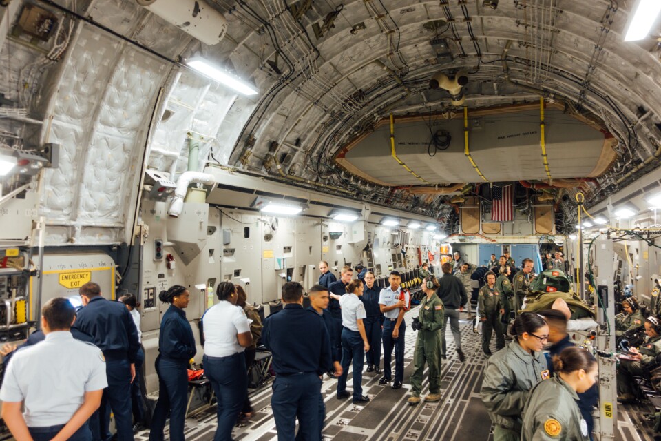 Air Force Junior Reserve Officer Training Corps cadets and Airmen participating in an aeromedical evacuation proficiency training mission aboard a Boeing C-17.