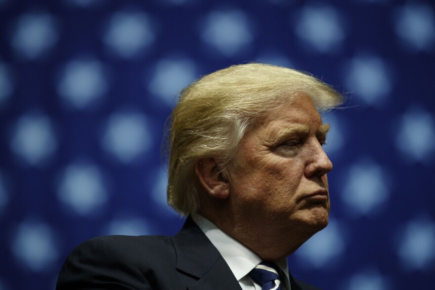 GRAND RAPIDS, MI - DECEMBER 9: President-elect Donald Trump looks on during at the DeltaPlex Arena, December 9, 2016 in Grand Rapids, Michigan. President-elect Donald Trump is continuing his victory tour across the country. (Photo by Drew Angerer/Getty Images)