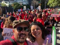 LAUSD parents Virginia Escamilla and Hugo Albuja march to support teachers leading up to their strike. Photo courtesy of Hugo Albuja.