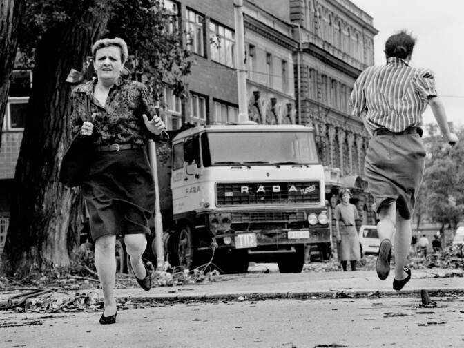 In this photo from 1992, women run across "Sniper Alley" under the sights of Serb gunmen during the siege of Sarajevo. 