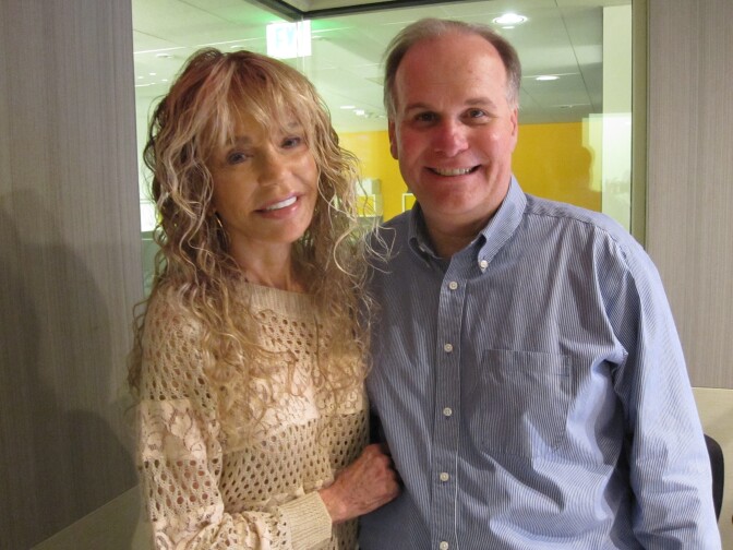 Larry Mantle with Dyan Cannon in studio.