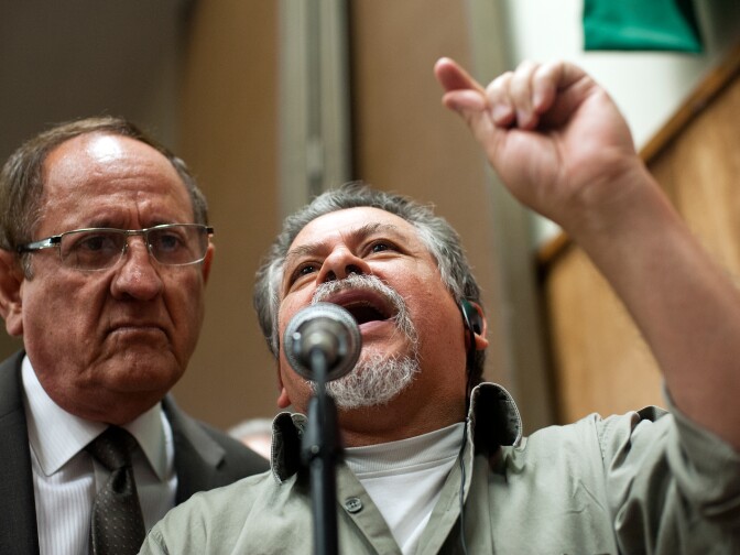 Hector Alvarado, right, of Padres Unidos de Maywood made a comparison between the federal government dealing with chemical weapon use in Syria to the chemical exposure from Exide Technologies.
