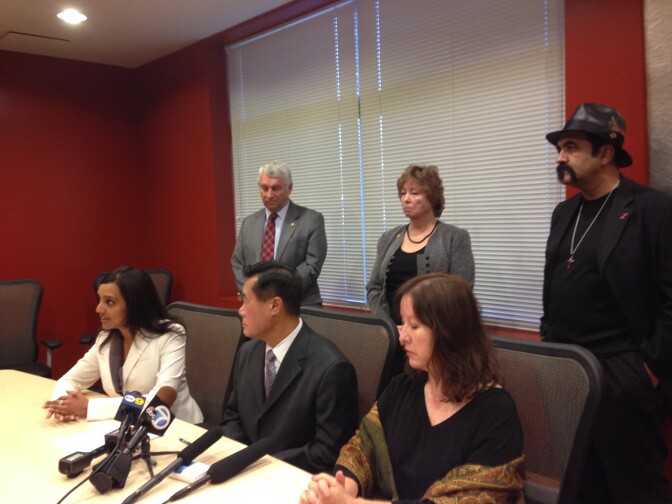 Supporters of a Riverside boy convicted of murdering his abusive father call for his pardon on November 5, 2013. In the front row, from left to right are: Defense attorney Punam Grewal; CA Senator Leland Yee; and Former CA Senator Gloria Romero; In the back row, from left to right are: Kenneth Bitting, Tania Whiteleather and Steve Figueroa who are advocates of the child.
