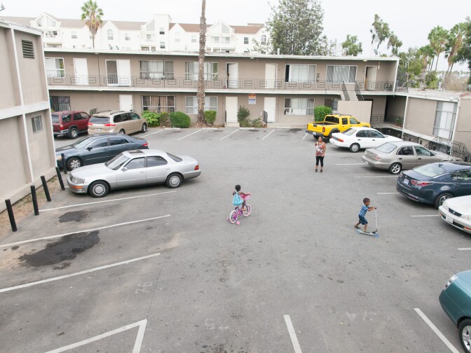 Delroy Haughton, 4 and and Diamond Terry, 4, play outside their apartment while Delroy's mother, Emily Zelaya watches, in Los Angeles, Calif. on Monday, Sept. 21, 2015. Delroy has asthma and his symptoms are made worse by the living conditions of his apartment.  