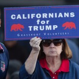 A supporter of Republican presidential candidate Donald Trump holds a sign during his campaign rally at the Orange County Fair and Event Center, April 28, 2016, in Costa Mesa, California. 
