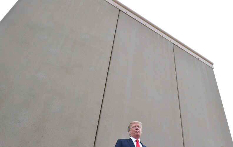 TOPSHOT - US President Donald Trump speaks during an inspection of border wall prototypes in San Diego, California on March 13, 2018.
Donald Trump -- making his first trip to California as president -- warned there would be "bedlam" without the controversial wall he wants to build on the border with Mexico, as he inspected several prototype barriers. The trip to the "Golden State" -- the most populous in the country and a Democratic stronghold -- was largely upstaged by his own announcement that he had sacked Secretary of State Rex Tillerson.
 / AFP PHOTO / MANDEL NGAN        (Photo credit should read MANDEL NGAN/AFP/Getty Images)