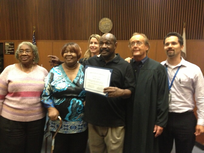 Willie Garner captures a graduation moment with Judge Michael Tynan who oversees Veterans Court, a program at L.A. Superior Court that allows war veterans to enter into an 18-month mental health and rehab program that could lead to criminal charges being dismissed after completion. 