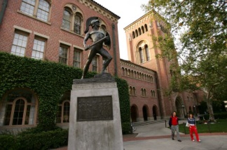 Students walk across the campus of the University of Southern California.