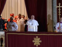 The new pope, Argentinian cardinal Jorge Mario Bergoglio, appears on the balcony of St Peter's Basilica after being elected the 266th pope of the Roman Catholic Church on March 13, 2013, at the Vatican.