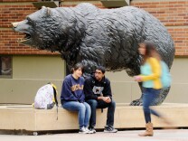 LOS ANGELES, CA - APRIL 23:  Students sit around the Bruin Bear statue during lunchtime on the campus of UCLA on April 23, 2012 in Los Angeles, California. According to reports, half of recent college graduates with bachelor's degrees are finding themselves underemployed or jobless.  (Photo by Kevork Djansezian/Getty Images)