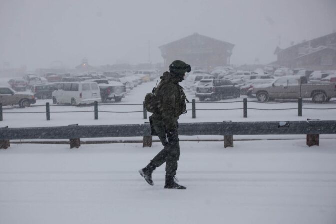 Snow falls at Bear Mountain Ski Resort where police are continuing the hunt for Christopher Dorner, suspected of killing three people in Southern California.