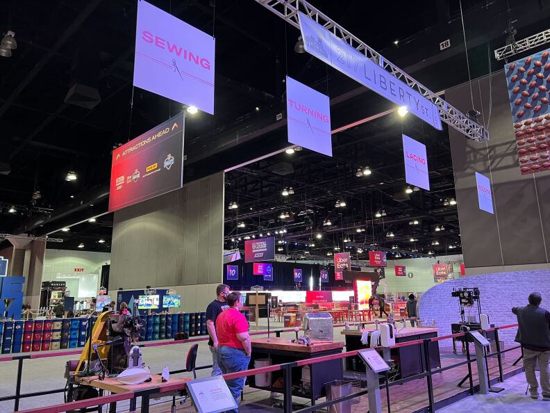 People walk through exhibits at Los Angeles Convention Center in Downtown Los Angeles.