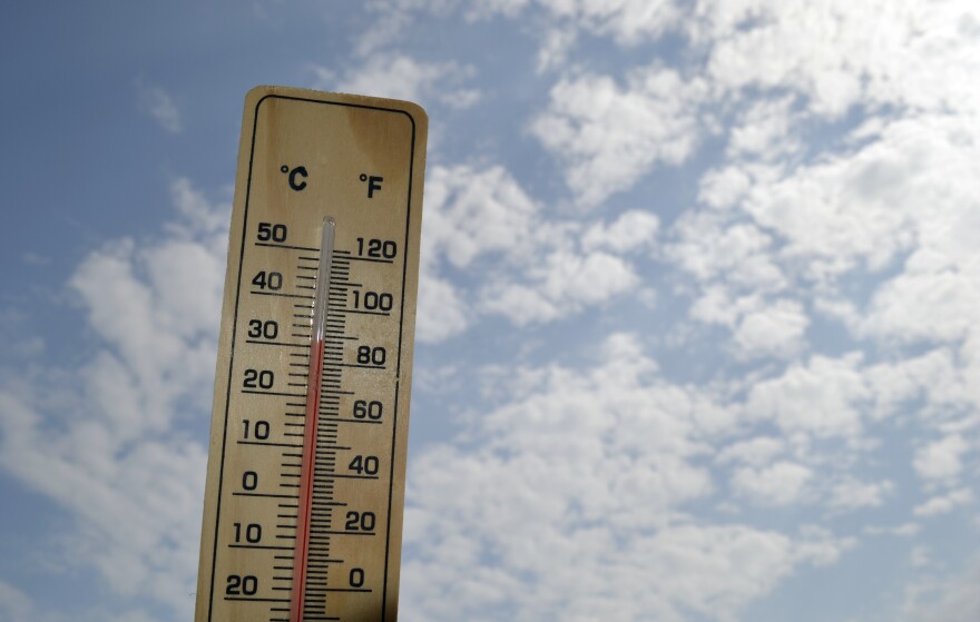 Thermometer shows the temperature at about 90 degrees Fahrenheit.