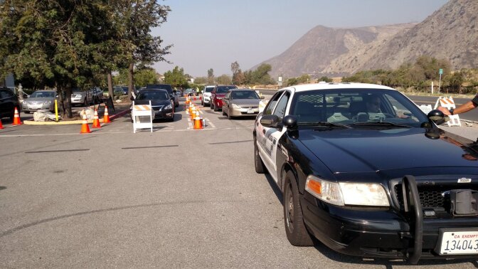 Sheriff's deputies escort Mountain Cove residents back in to their homes to retrieve essential items. 