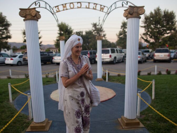 Simran Kaur Khalsa of West Hollywood greets friends as she approaches the gurdwara at the Khalsa Care Foundation on Monday, August 6.