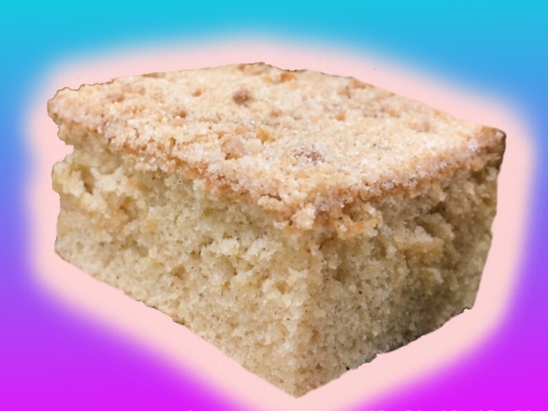 a piece of coffee cake with a glowing pink outline against a purple and blue background