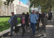 Defendants in a case against Los Angeles Sheriff's Department employees, their attorneys and their supporters leaving court on Tuesday, July 1, 2014.