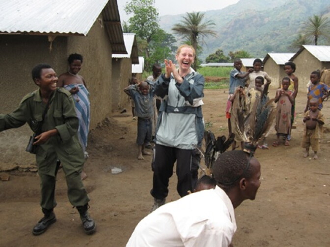 Elisa Kotin dances with the villagers of a Batwa Pygmy community in Uganda.                            
