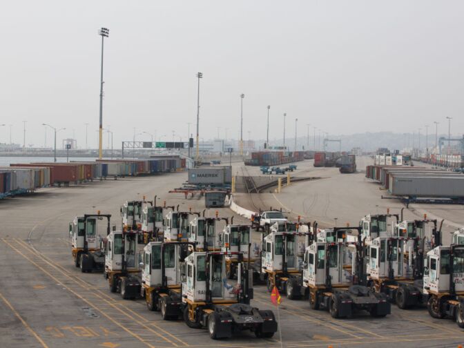 Trucks remain idle at the APM Terminals at the Port of Los Angeles as a result of the clerical workers strike.