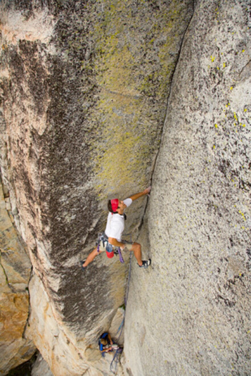 Man rockclimbing at Tahquitz Rock in Idyllwild, CA. Tahquitz Rock is where the demon's spirit is said to have flown after he was killed and burned with "green wood." 