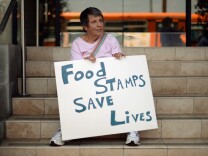 Members of Progressive Democrats of America and other activists hold a rally in front of Rep. Henry Waxman's office on June 17, 2013 in Los Angeles, California. The protestors were  asking the congressman to vote against a House farm bill that would reduce federal spending on the Supplemental Nutritional Assistance Program by $20.5 billion and affect food stamps and other services for the poor.   