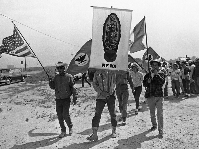 FILE - In this April 7, 1966 file photo, grape strikers on a 300-mile march from Delano, Calif., approach their goal, the Capitol in Sacramento. On Labor Day weekend of 2015, hundreds of former and current labor activists, both Filipino and Mexican American, flowed into the Central Valley town of Delano where 50 years ago, they launched the Delano grape strike that altered the course of American history. (AP Photo/Walter Zeboski, File)