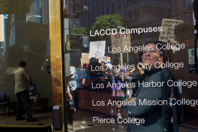 Protestors make a stop near the Los Angeles Community College District building on the one year anniversary of Los Angeles' Occupy movement in Los Angeles, Calif., Monday, October 1, 2012. More than 300 protestors gathered at Pershing Square to celebrate and march around downtown.