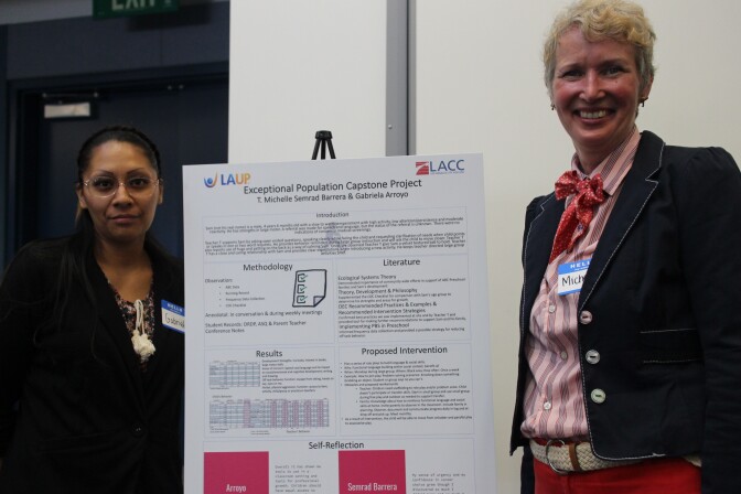 Gabriela Arroyo and Michelle Semrad Barrera pose next to a poster they presented to leaders of LAUP and LA City College before they graduated from the new Exceptional Populations Certificate program.