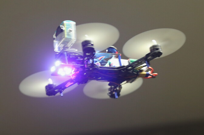 BERLIN, GERMANY - DECEMBER 02: A mini quadcopter drone meant for FPV racing flies in a hall during a gathering of drone enthusiasts on December 2, 2015 in Berlin, Germany. Drone racing is becoming an increasingly popular pastime in North America and Europe with racing competitions occrurring reguarly.   (Photo by Sean Gallup/Getty Images)