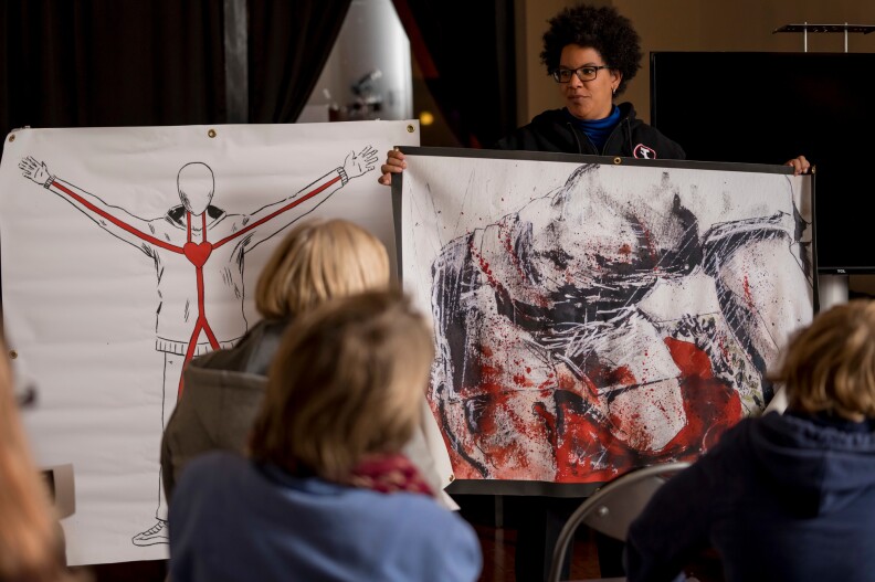 Participants listen to Dr. Laurie Punch, a trauma surgeon at Barnes-Jewish Hospital in St. Louis, as she teaches a "Stop the Bleed" class in November in St. Louis. Attendees learn far more than how to staunch a hemorrhage, Punch says. They also start to identify as helpers.