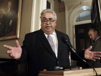 FILE - In this Monday June 10, 2013, file photo State Sen. Ron Calderon, D-Montebello, left, holds a brief news conference during first appearance at the Capitol since the FBI investigators raided his offices in Sacramento, Calif. Sen. Calderon was a no-show with an unexcused absence after at least a half-dozen FBI agents carted boxes from his Sacramento offices following a more than six-hour search in June 2013. Sen. Calderon did not answer any questions and no details have been given for the search and no charges have been filed. (AP Photo/Rich Pedroncelli, File)