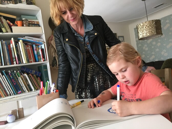 Claire Keane and her son Roman draw at their home in Venice. She is a third-generation artist and illustrator, to which, she believes her children might continue that linage. Photo by Erika Aguilar. 

