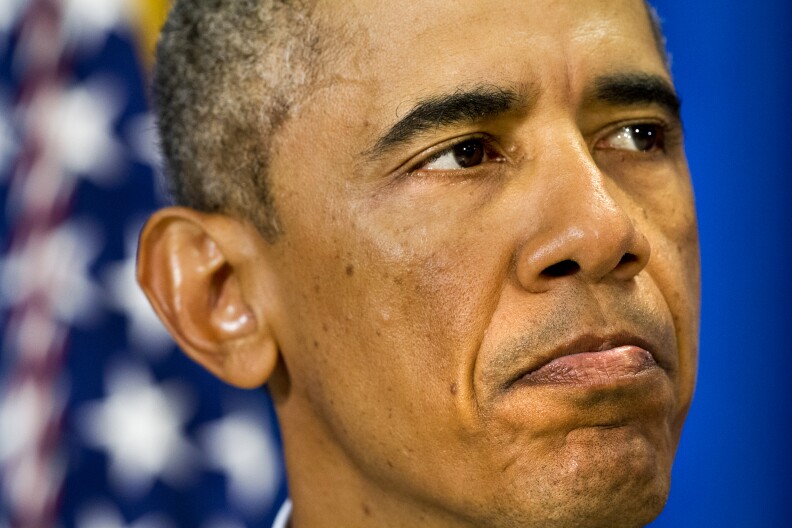 U.S. President Barack Obama pauses as he speaks about the killing of journalist James Foley in Syria during a statement in Edgartown, Mass., Wednesday, Aug. 20, 2014. The president said the U.S. will continue to confront Islamic State extremists despite Foley's brutal murder. Obama said he spoke Wednesday with Foley's family and offered condolences. (AP Photo/Jacquelyn Martin)