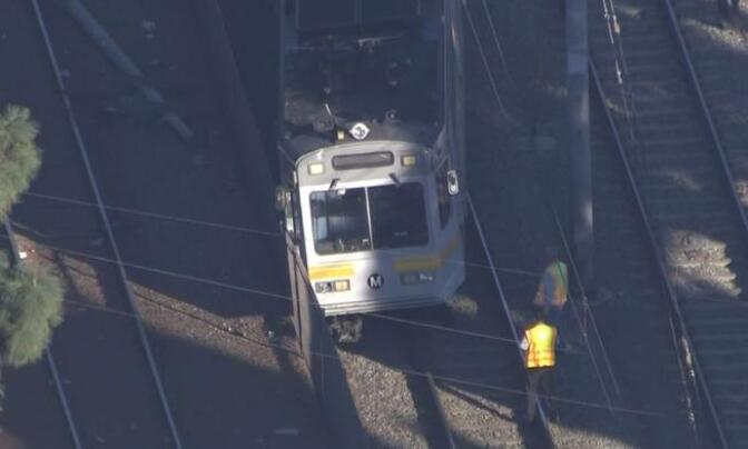 A Metro Los Angeles train derailed after it collided with a car in Compton on Monday, Nov. 23, 2015.