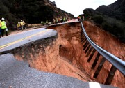 Caltrans and state emergency officials inspect a damaged section of Highway 330 near Highland on Thursday, Jan. 6, 2011. It could take up to two years to repair the storm-damaged roadway. 
