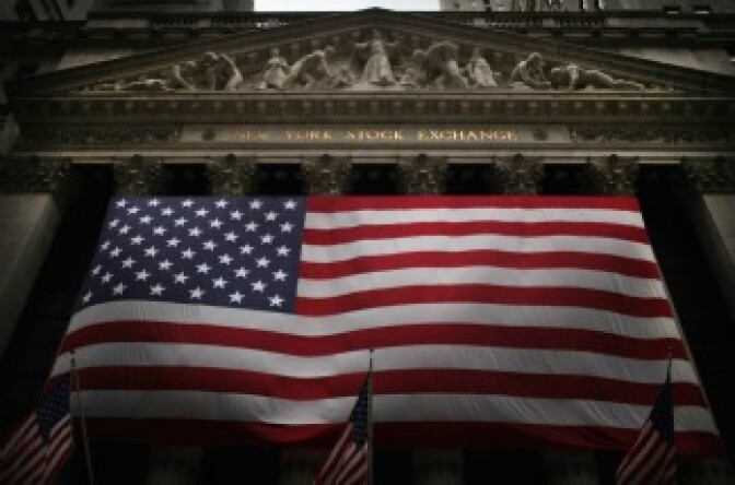 An American flag hangs in front of the New York Stock Exchange on August 15, 2011 in New York City.