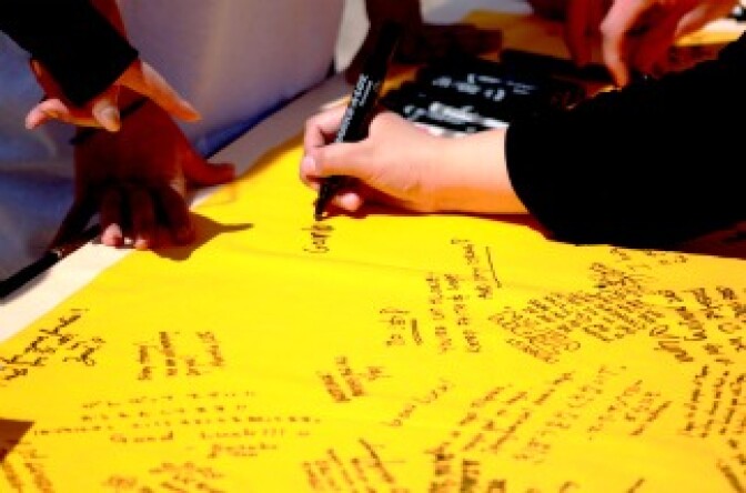 UC Riverside students and staff sign memorial banner for the campus community at their sister city, Tohoku University in Sendai, Japan. 