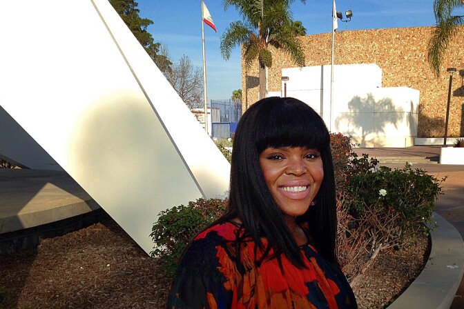 Compton May Aja Brown standing in front of the Martin Luther King Memorial near Compton City Hall.