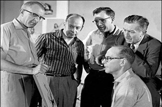 Walt Disney with four of his "Nine Old Men," circa 1957. Standing left to right are Milt Kahl, Marc Davis, Frank Thomas, and Walt Disney. Ollie Johnston, who died Monday, April 14, is seated in the foreground.