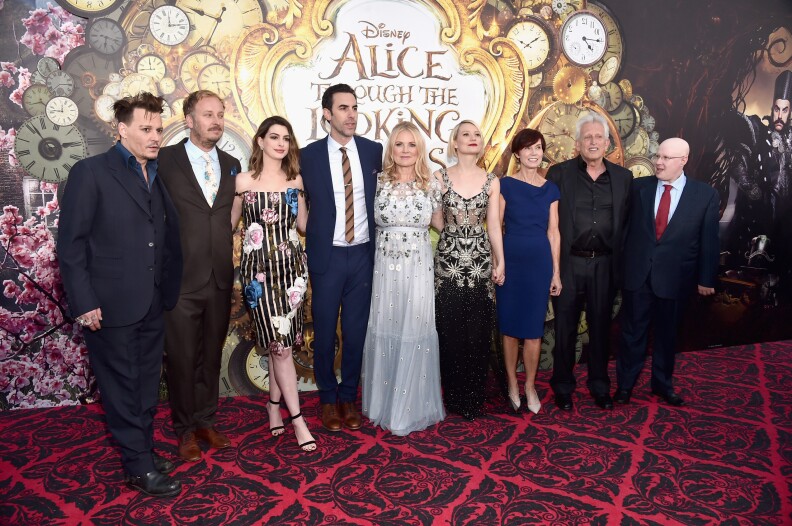 HOLLYWOOD, CA - MAY 23: (L-R) Actor Johnny Depp, director James Bobin, actors Anne Hathaway, Sacha Baron Cohen, producer Suzanne Todd, Mia Wasikowska, screenwriter Linda Wollverton, producer Joe Roth and actor Matt Lucas attend Disneys 'Alice Through the Looking Glass' premiere with the cast of the film, which included Johnny Depp, Anne Hathaway, Mia Wasikowska and Sacha Baron Cohen at the El Capitan Theatre on May 23, 2016 in Hollywood, California.  (Photo by Alberto E. Rodriguez/Getty Images for Disney)