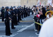 Protesters begin to face off with police outside the Metropolitan Detention Center as part of the "No Kings" protest on October 18, 2025 in Los Angeles.