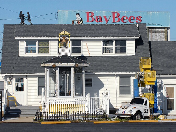 The "BayBees" children's pediatrics office of Dr. Earl Bradley is shown, above, weeks after Bradley was accused of molesting dozens of children at his practice, and, below, after workers removed the signs and attractions, which included a mini-Ferris wheel and carousel.