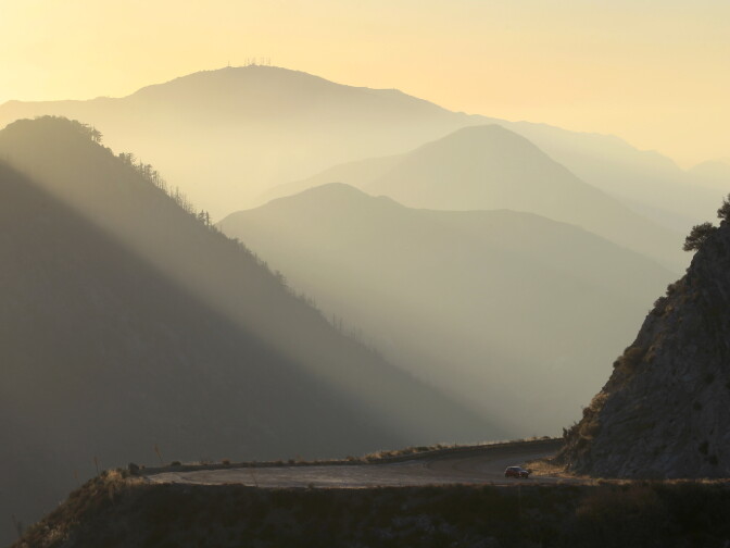 A driver rides the Angeles Crest Highway (State Route 2) in the Angeles National Forest on October 2, 2013 in the San Gabriel Mountains, northeast of Los Angeles, California. 