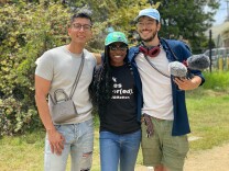 The three producers of How To LA stand next to each other to pose in a picture. 